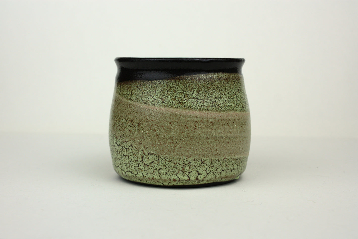 Green crawl glaze mug with pink detail