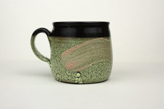 Green crawl glaze mug with pink detail